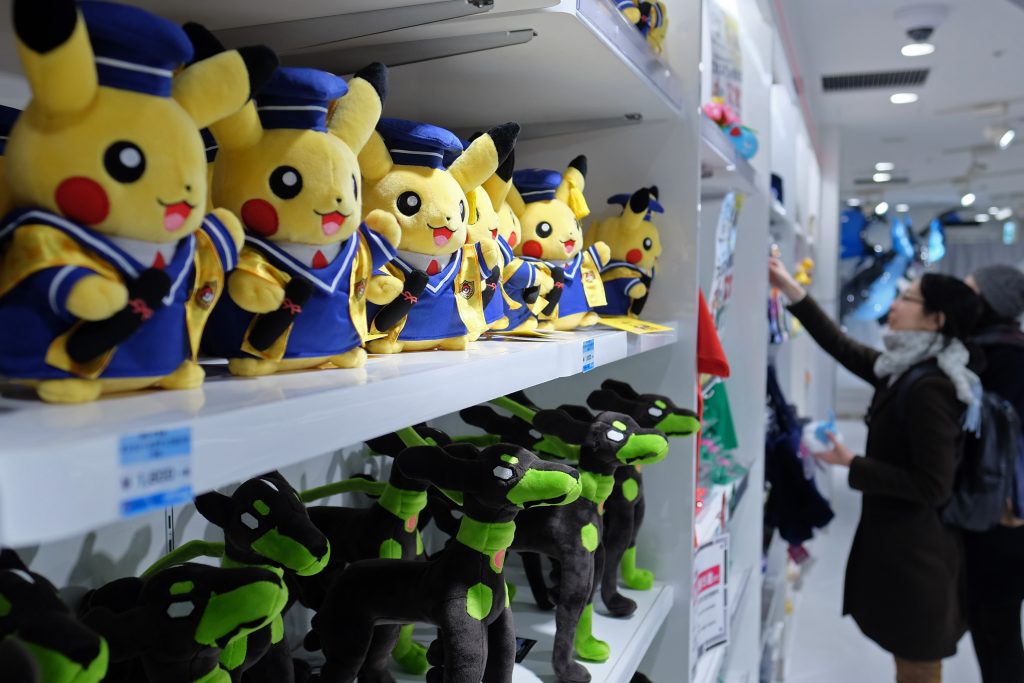 Pikachu plush toys, top left, are displayed for sale at the Pokemon Center Mega Tokyo store in Tokyo, Japan, on Wednesday, Feb. 24, 2016. Pokemon, a multi-media franchise by Nintendo Co., will mark its 20th anniversary on Feb. 27. Photographer: Yuriko Nakao/Bloomberg